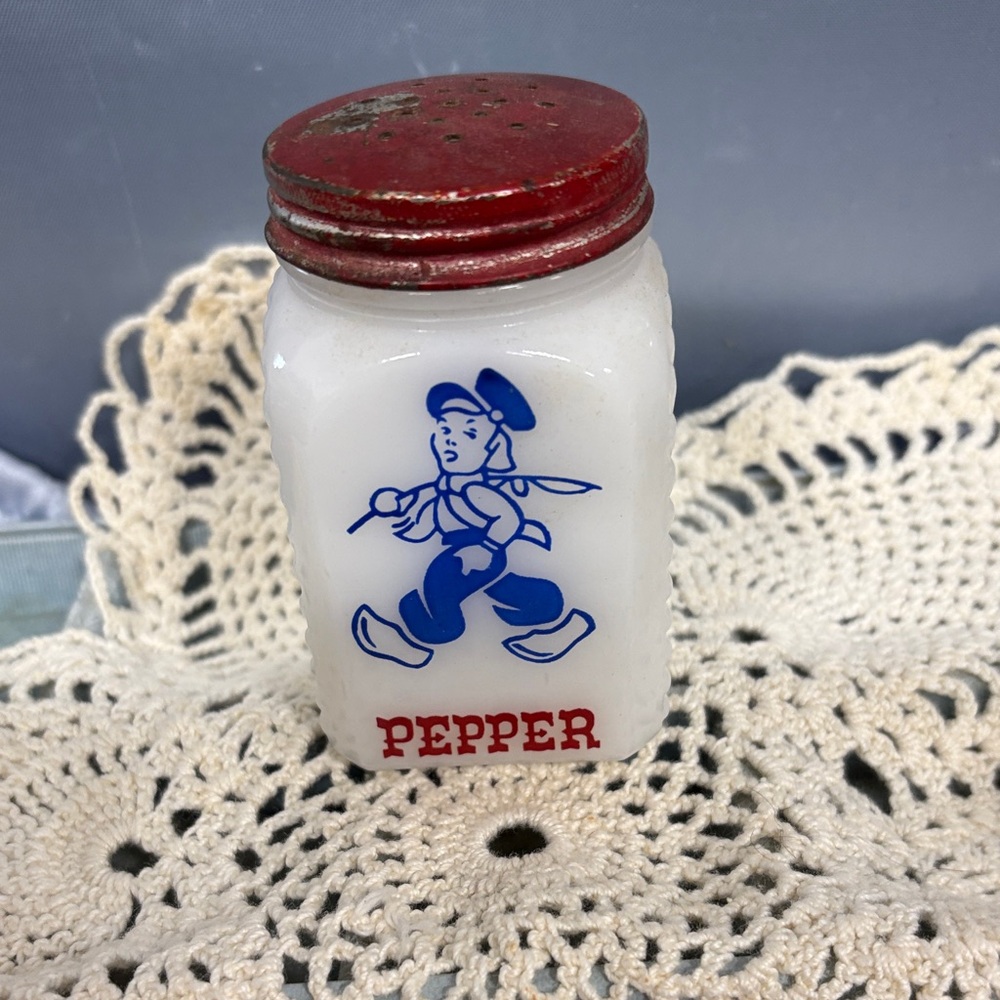 Vintage Milk Glass Pepper Shaker with Red Lid and Blue Graphic